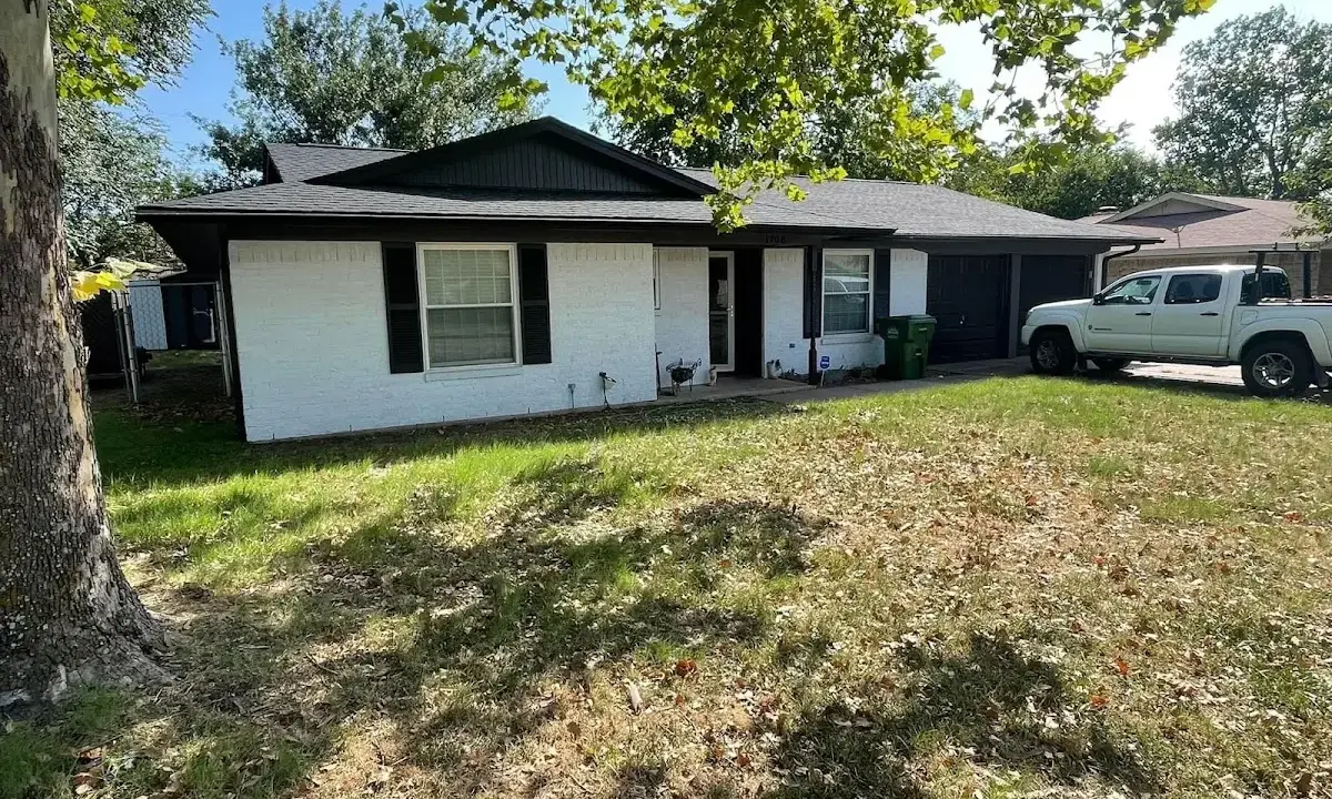 Professional roofing crew working on a residential roof in Levelland